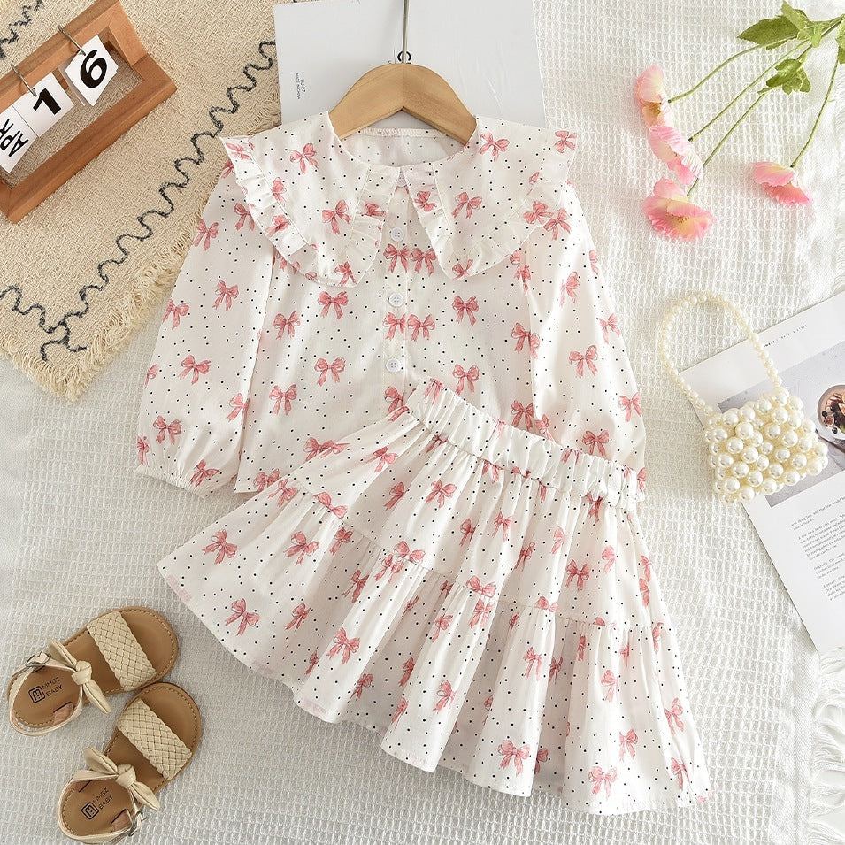 Cross-Border Hot-Selling Korean-Style Children's Clothing New Bow Print Long-Sleeve Doll Shirt Short Skirt Girls' 2026 Spring and Autumn Set