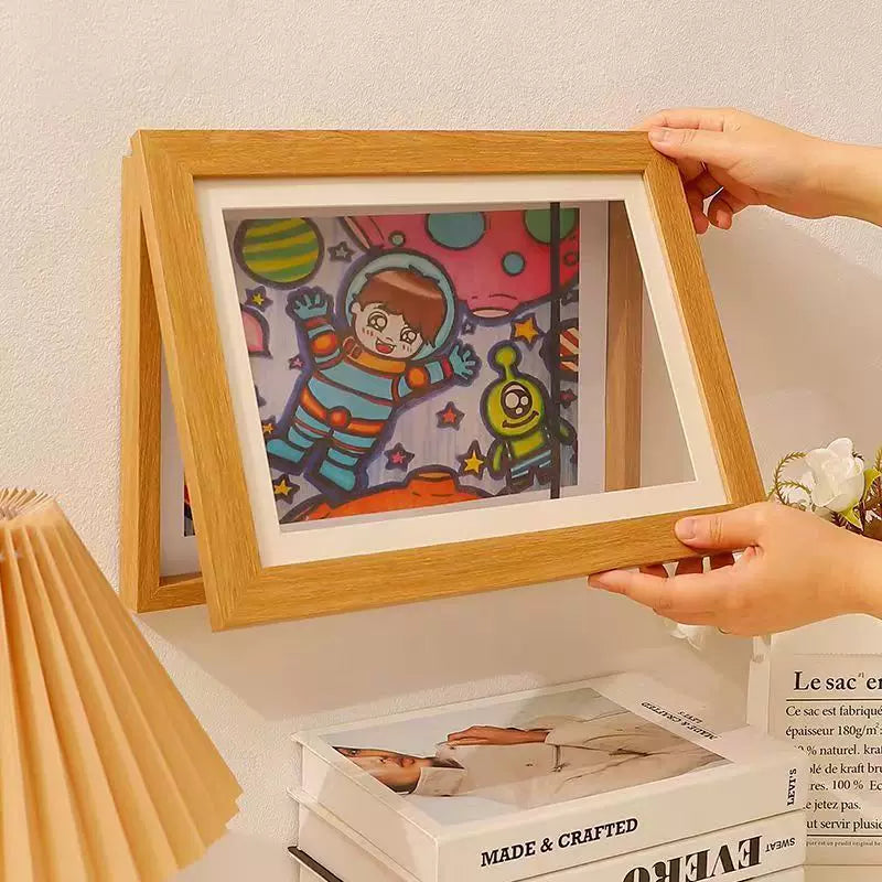 Quick-release picture frame for storage and display of children's paintings; magnetic mounting