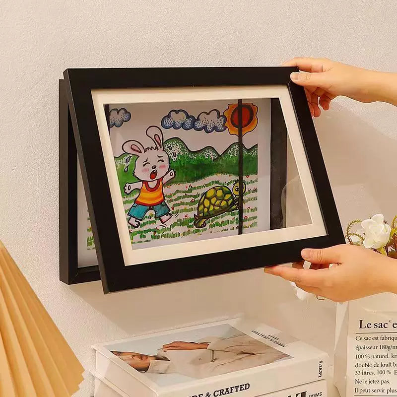 Quick-release picture frame for storage and display of children's paintings; magnetic mounting